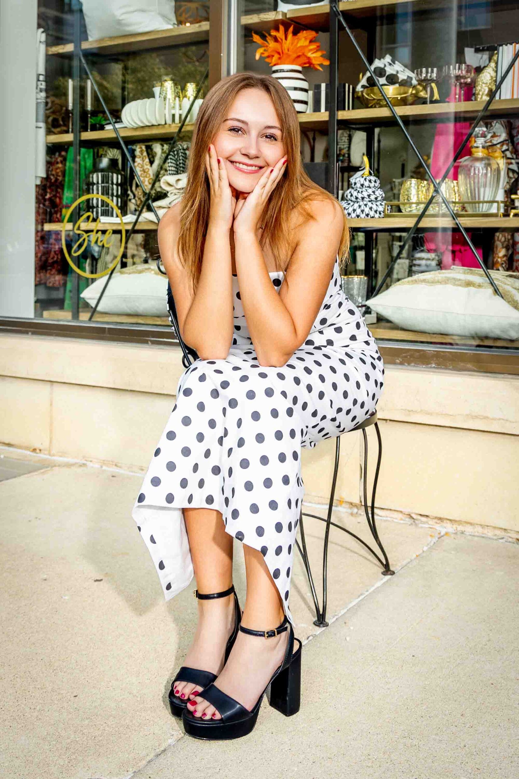 Senior picture taken next to shops in Historic East Village